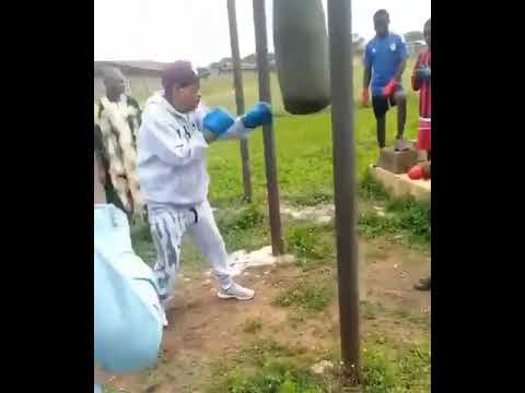 ALAAFIN OF OYO TRAINING WITH A PUNCHING BAG