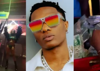 “Waste of money” – Knock as Wizkid storms Lagos strip club with briefcase filled with bundles of naira notes